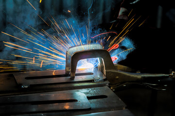 Professional welder specializes in conducting welding operations with semi automatic argon arc welding techniques.