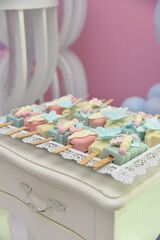 cake decorated with sugar frosting on top of a stand