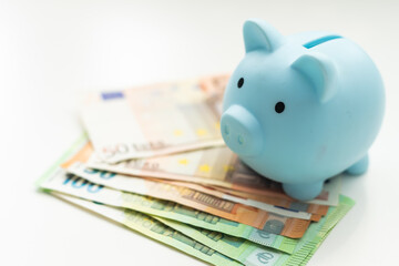 Piggy bank with money isolated on white