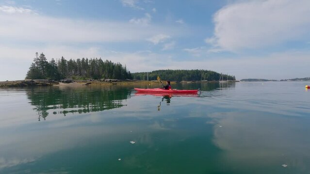 person kayaking in Stonington, Maine 
