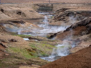 Closeup of Multicolored soil of the Seltun geothermal field on a sunny day