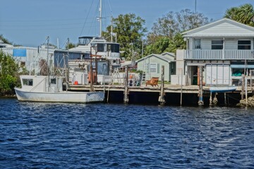 Fototapeta na wymiar Boat moored by a dock in Tarpon Springs Florida harbor
