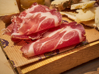 Cold cut board with prosciutto and cheese slices as served in Cuneo, Piemonte, Italy
