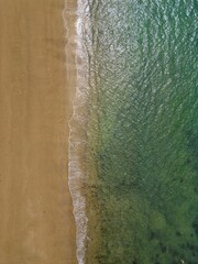 vertical drone shot of a beach in the United Kingdom, top down shot