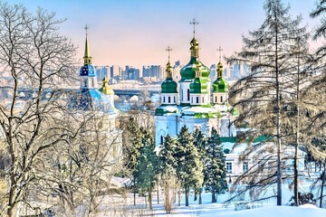 View of the Vydubitsky Monastery in winter. Founded between 1070 and 1077. View from the Botanical Garden of the city of Kyiv, Ukraine.