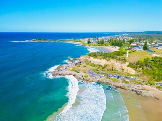 Aerial view of Yamba Main Beach against the ocean on a sunny day