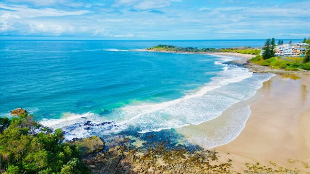 Aerial view of Yamba Main Beach against the ocean on a sunny day