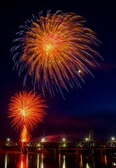 Vibrant festive fireworks over the Meridian Highway Bridge at night