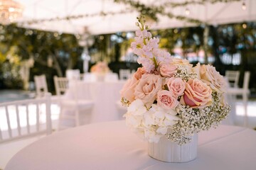 Closeup of a bouquet of roses on a table at a wedding