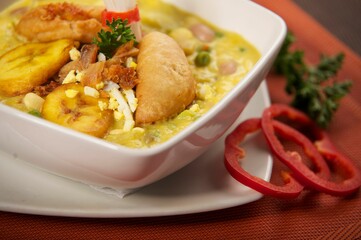 photography of a traditional ecuatorian soup called Fanesca and mashed potatoes
