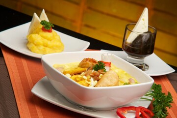 photography of a bowl of a traditional ecuatorian soup called Fanesca and mashed potatoes
