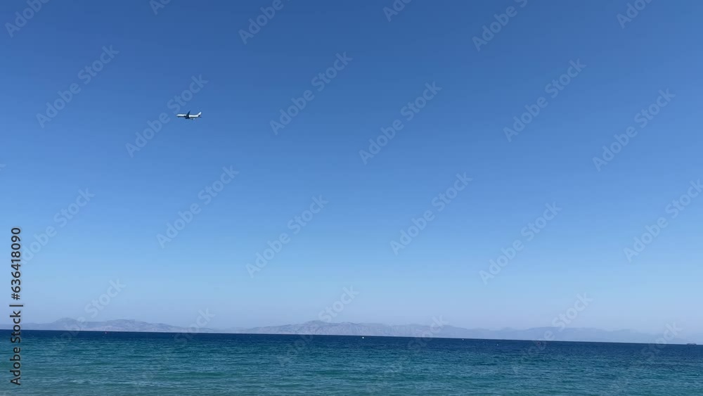 Poster plane flying in the blue sky over seascape, for wallpaper