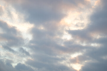 Obraz premium gray clouds through which the rays of the sun break through