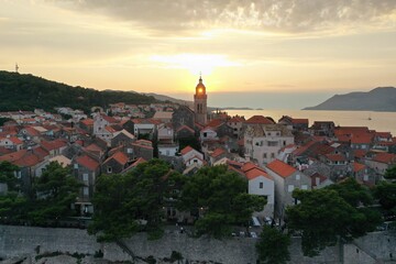 Fototapeta na wymiar Scenic aerial view of a vibrant town with a stunning blue sea in the background in Croatia