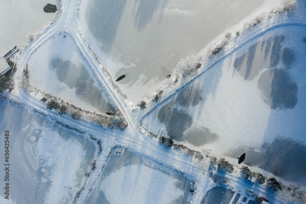 Canvas Prints aerial view of a snowy landscape featuring a frozen water