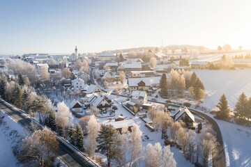 aerial view of a picturesque city under the blue sky in winter