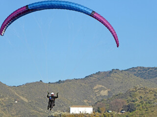 Paraglider landing at Cenes de la Vega in Spain	