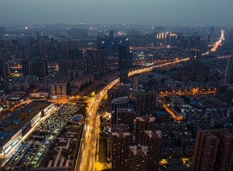 Fototapeta na wymiar Aerial shot of the cityscape of Wuhan at nighttime, China.