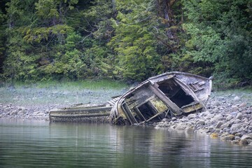 Abandoned Old Boats On The Rocks