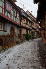 Charming Street with Old Houses in Beautiful village Eguisheim, in christmas time, Alsace, France