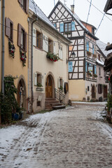 Charming Street with Old Houses in Beautiful village Eguisheim, in christmas time, Alsace, France