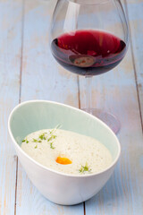 fresh chervil soup in a bowl on wood