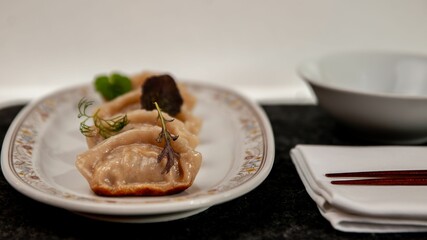 Close-up of a plate full of delicious gyoza dumplings