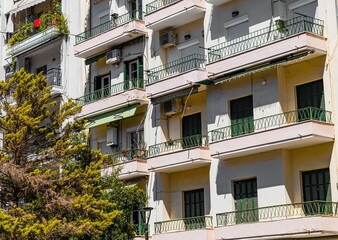 Fototapeta na wymiar City of Thessaloniki, Greece, showcasing a tall building with multiple balconies