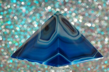 Closeup shot of a blue pyramid of agate with quartz inclusions