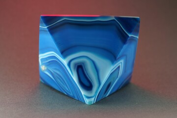 Closeup shot of a blue pyramid of agate with quartz inclusions