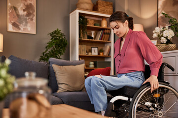 Beautiful independent woman in wheelchair at home.