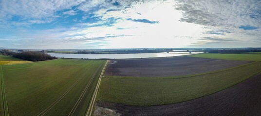 Beautiful view of Danube with agricultural fields in winter in Bavaria
