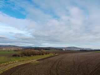 Fototapeta premium the road winding up to the farm in front of the farm