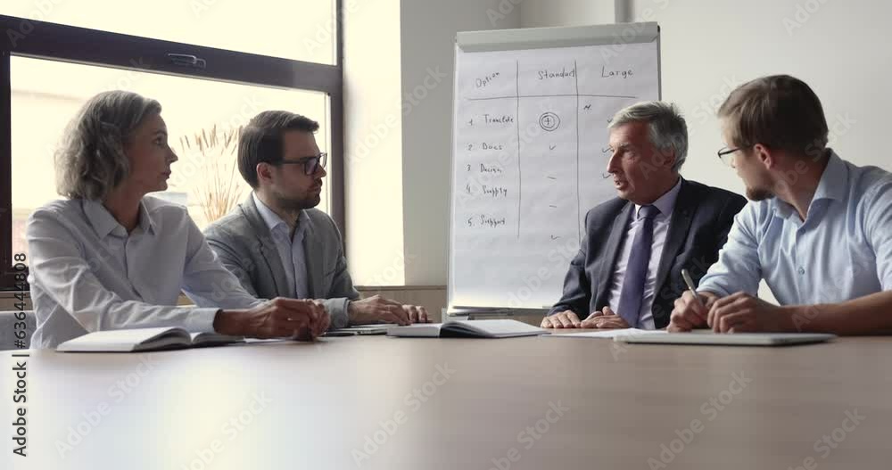 Poster Senior business leader, executive man meeting with team in boardroom, talking to employees, discussing supply package, speaking with hands gestures, explaining work plan, giving instruction, task