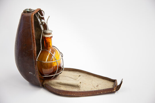 Antique anaesthesia kit. Leather case. Bottle for the anaesthetic ether or chloroform. Iron mask in which a cloth soaked in anaesthetic was placed and applied over the patient's nose and mouth. 