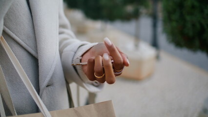 Hand holding house keys outside closeup. Real estate agent waiting rent client