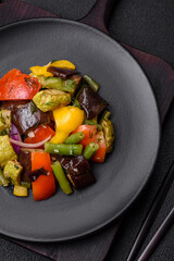 Delicious juicy fresh salad of baked eggplant, tomatoes, zucchini, onions