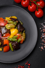 Delicious juicy fresh salad of baked eggplant, tomatoes, zucchini, onions