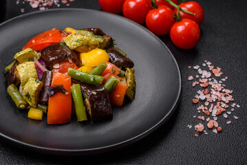 Delicious juicy fresh salad of baked eggplant, tomatoes, zucchini, onions