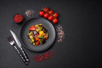 Delicious juicy fresh salad of baked eggplant, tomatoes, zucchini, onions