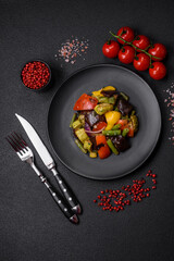 Delicious juicy fresh salad of baked eggplant, tomatoes, zucchini, onions