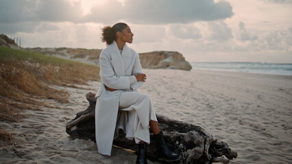 Fototapeta premium Despair woman looking ocean waves resting alone. Nervous sad girl thinking life