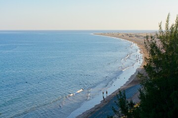 Playa del Ingles beach at sunset in Maspalomas, Gran Canaria, Spain