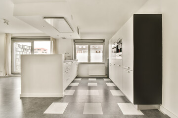 an empty kitchen with white cabinets and black appliances on the countertop in this room is very clean, but it's not