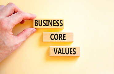 Business core values symbol. Concept words Business core values on wooden block. Beautiful white background. Businessman hand. Business motivational business core values concept. Copy space.