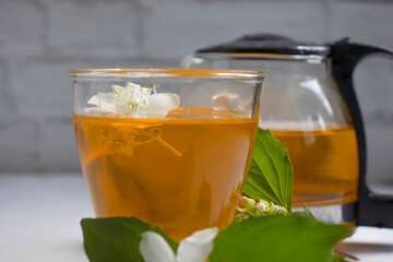 tea with jasmine on an old background
