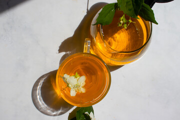 tea with jasmine on an old background