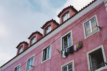 Obraz premium On a pink wall of Alfama, Lisbon.