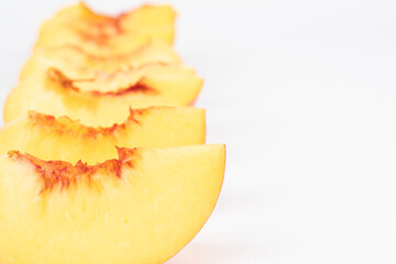 Row of sliced peaches close up