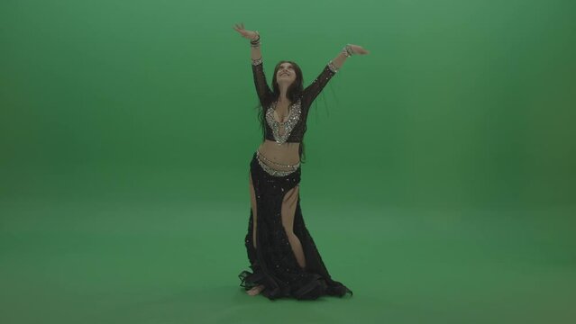 Adorable belly dancer in black wear display amazing dance moves over chromakey background